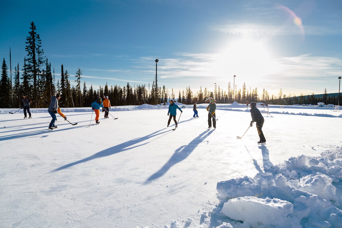 People playing hockey at the outdoor rink at Big White
