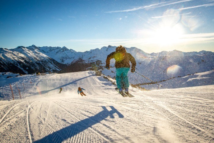 Three people skiing in Whistler during the day