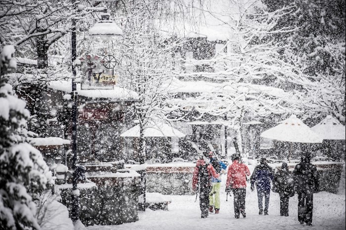 Family walks through snow at Whistler-Blackcomb