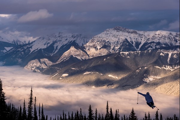 Man kicks skis off a jump at Kicking Horse on the Powder Highway