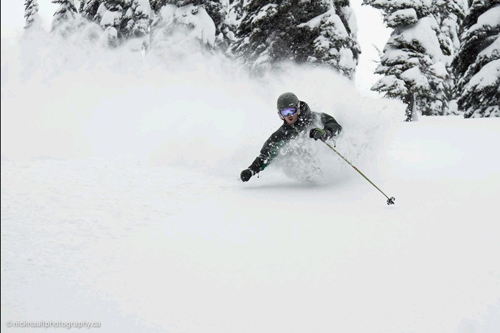 Skier enjoys early season powder skiing in December at Fernie