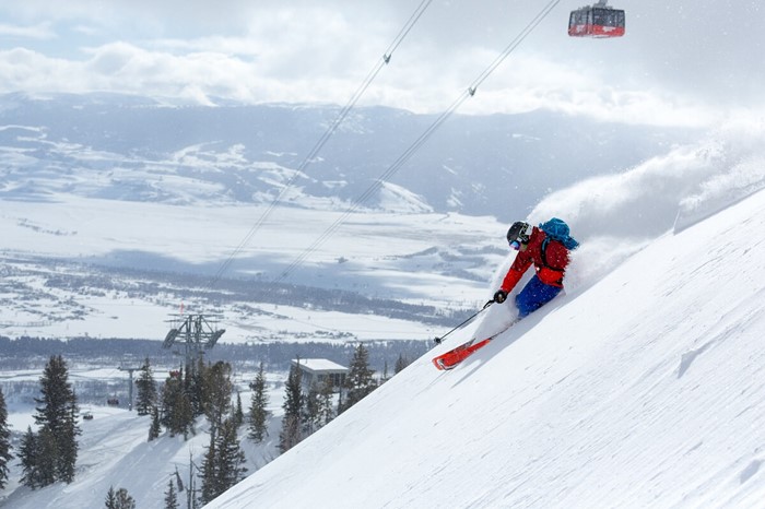 Skiing under the gondola on guys ski trip at Jackson Hole