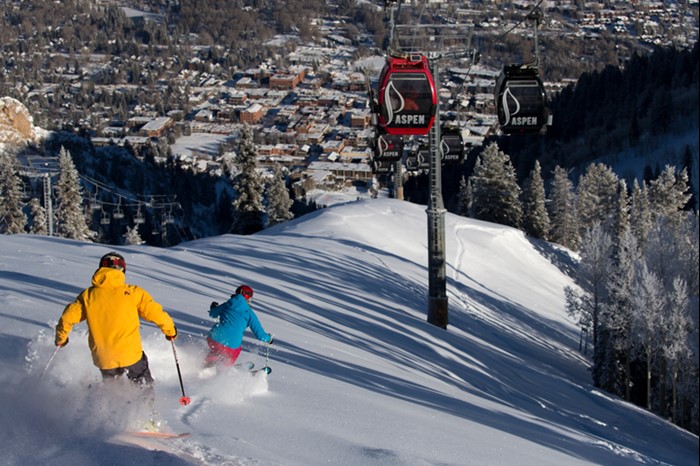 Group skiing the vertical under the chair at Aspen-Snowmass