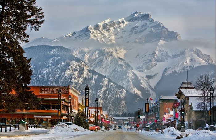 Downtown Banff with a view of the Rocky Mountains in the background