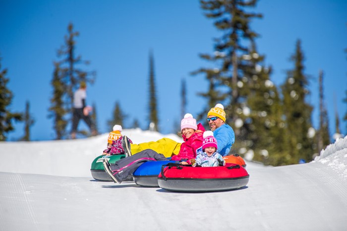 Family enjoy winter tubing at Big White