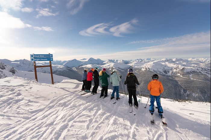 Group of skiers under the 7th Heaven chair at Blackcomb