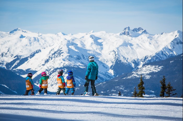 Group of beginner skiers in ski school at Whistler Blackcomb