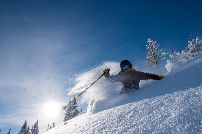 Woman enjoying powder day at Banff Sunshine Village