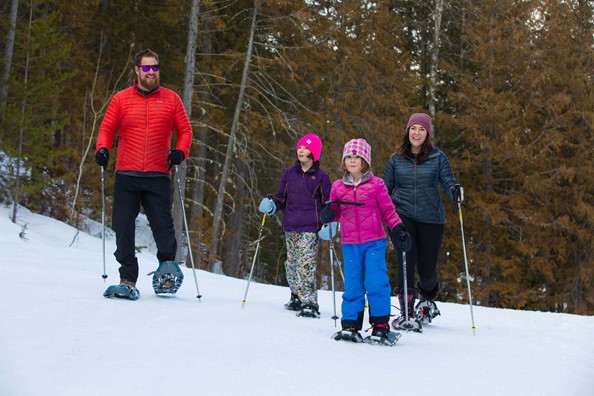 Family of 4 snowshoeing