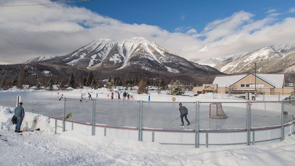 NHL-sized ice rink with the mountain behind it